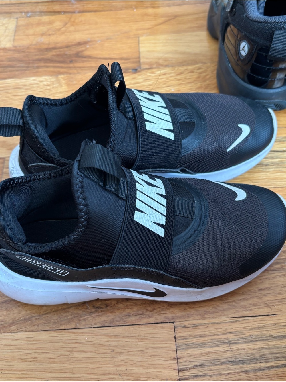 Nike Kids Black and White Slip-On Athletic Sneakers